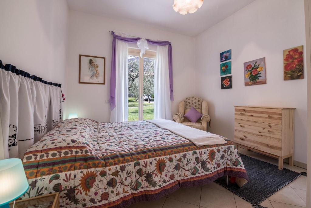 Posteľ alebo postele v izbe v ubytovaní Apartment Loretta in Villa Fiore