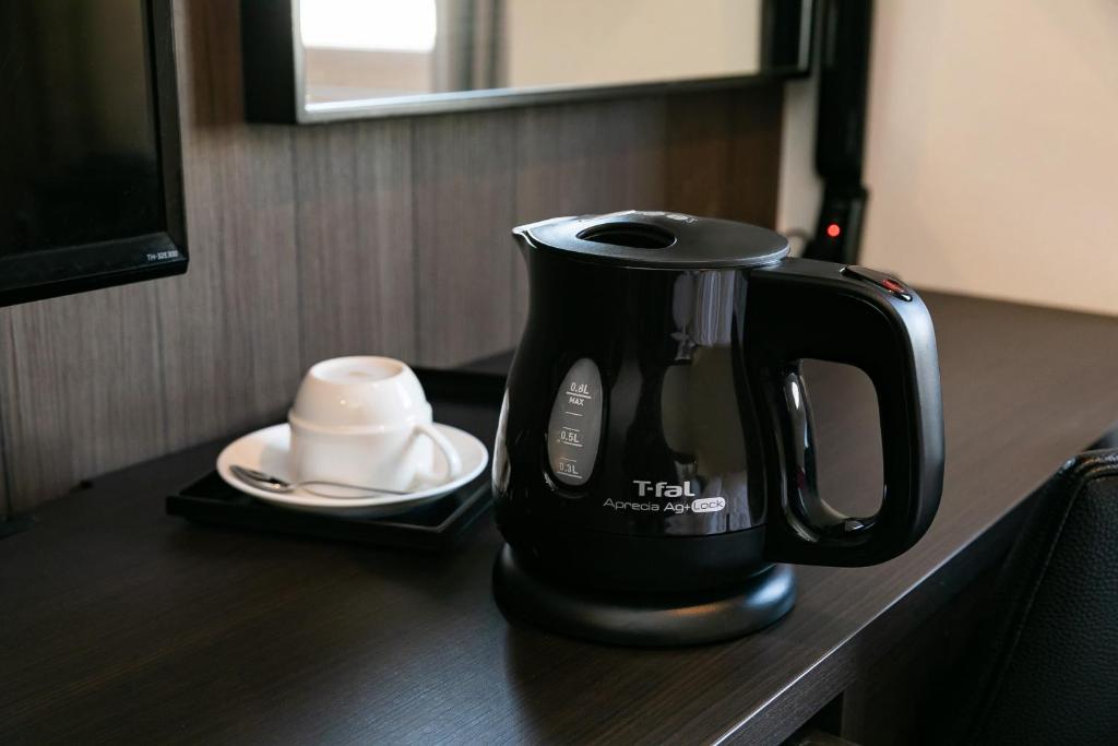 Příslušenství pro přípravu čaje a kávy v ubytování Goi Grand Hotel