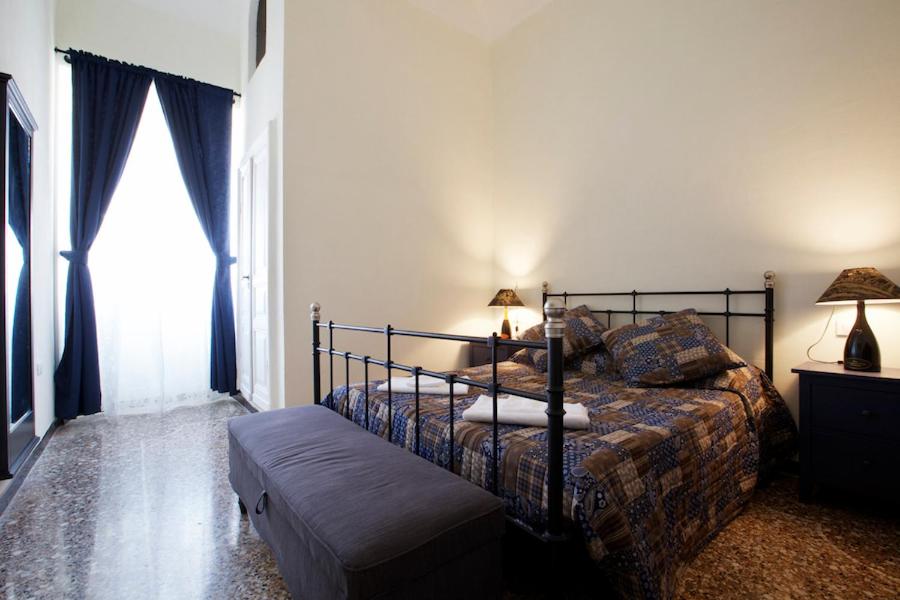 a bedroom with a bed and a window at NORMA in Levanto