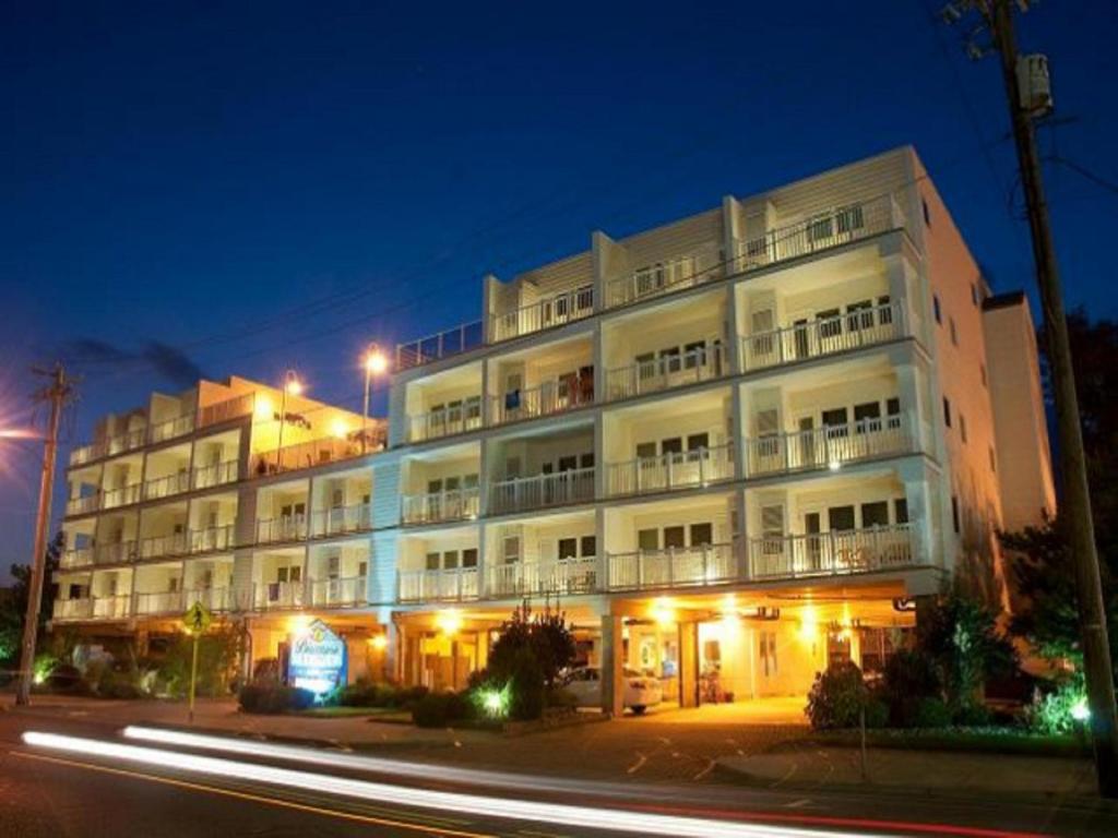 a large white building with a street in front of it at Biscayne Suites in Ocean City