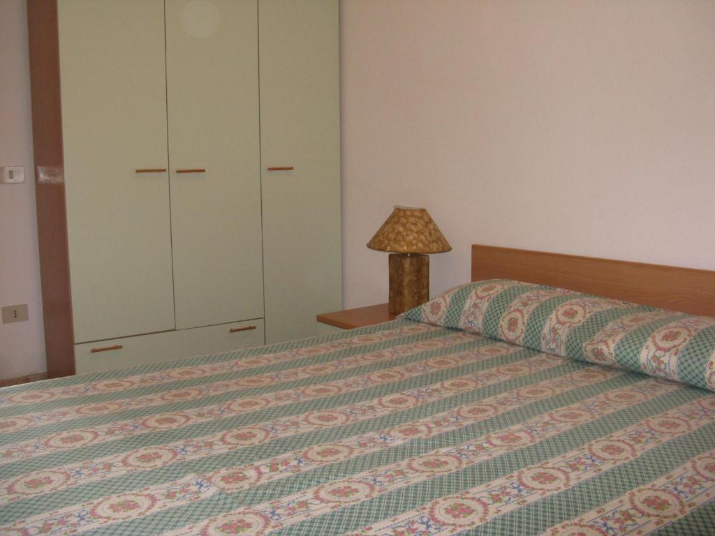 Postel nebo postele na pokoji v ubytování Miramare Isola Rossa