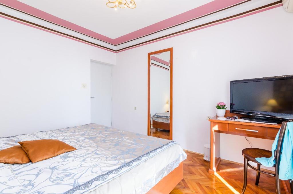 Posteľ alebo postele v izbe v ubytovaní Apartments Nicol