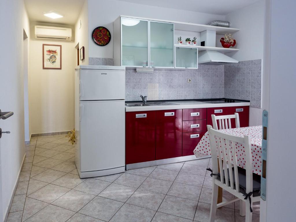 Kuchyň nebo kuchyňský kout v ubytování Apartments Summer Bloom