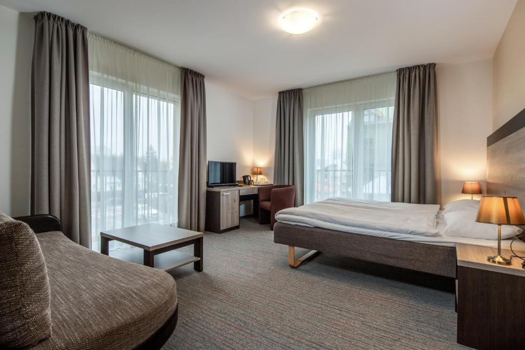 Ένα ή περισσότερα κρεβάτια σε δωμάτιο στο Labas Rytas Vila