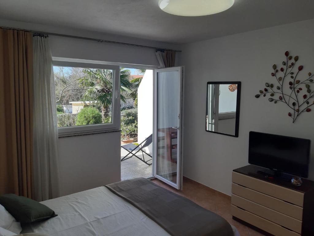 Postel nebo postele na pokoji v ubytování Apartments Summer Bloom