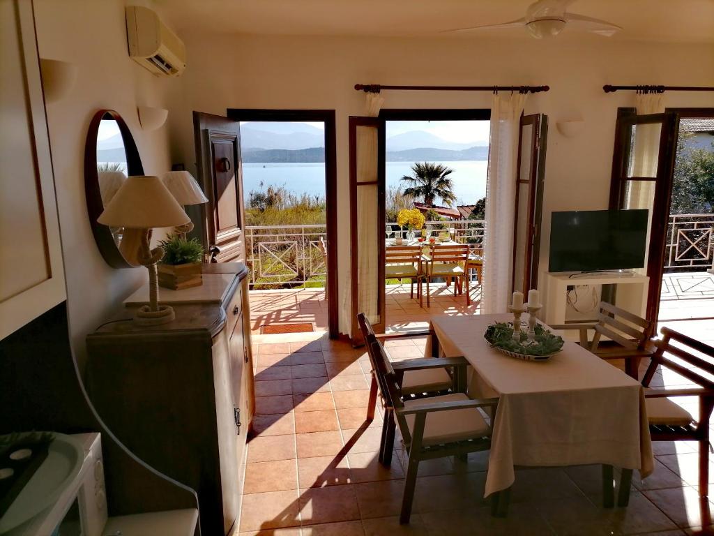 A television and/or entertainment centre at Alekos Beach Houses-Alekos Beach Complex