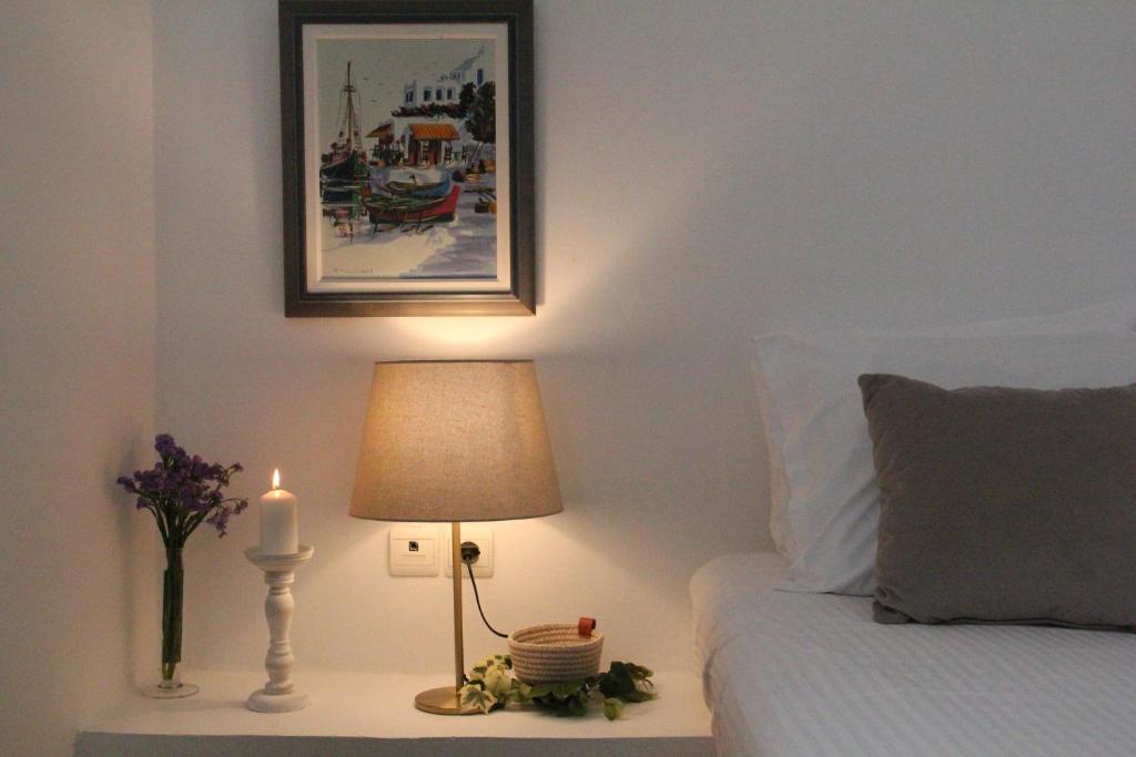 A bed or beds in a room at Alekos Beach Houses-Alekos Beach Complex