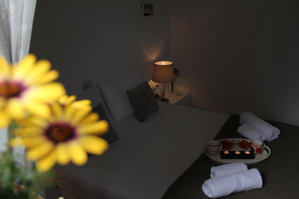A bed or beds in a room at Alekos Beach Houses-Alekos Beach Complex
