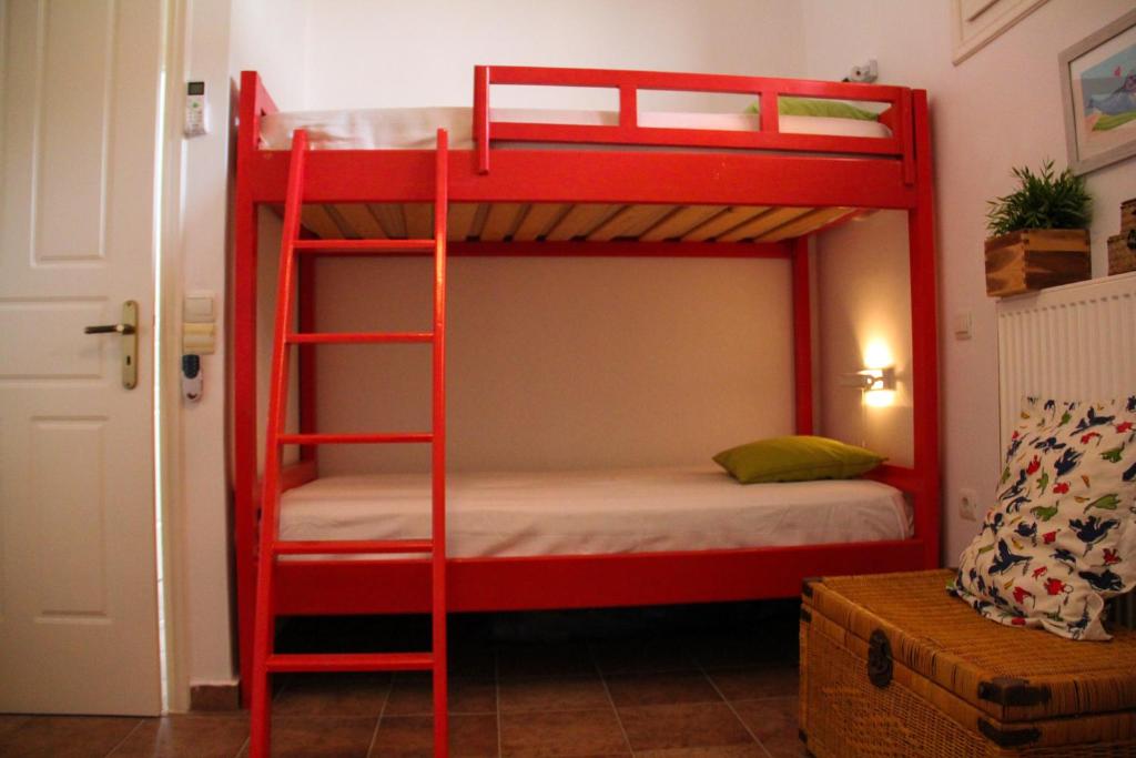 A bed or beds in a room at Alekos Beach Houses-Alekos Beach Complex