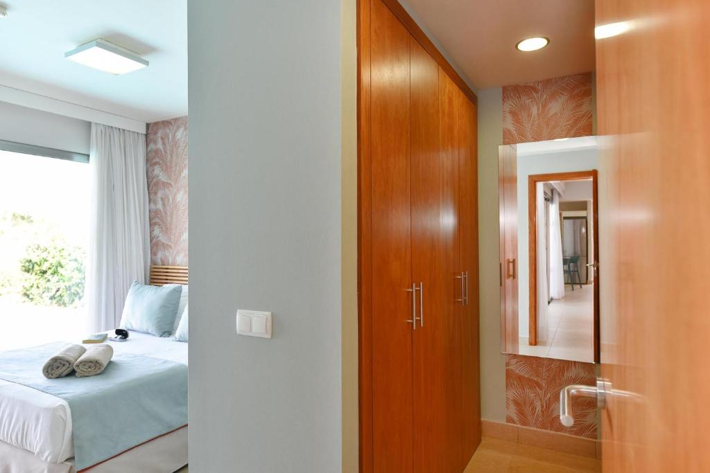 A bed or beds in a room at Albatross by VillaGranCanaria