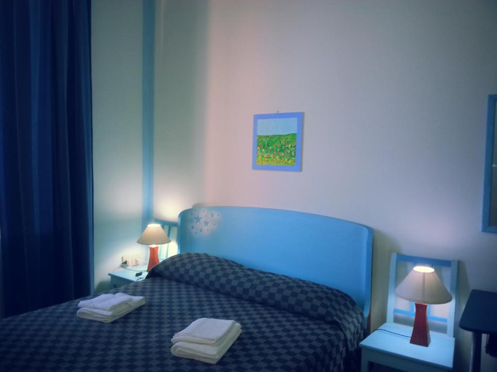 A bed or beds in a room at Il Giardino Del Purgatorio