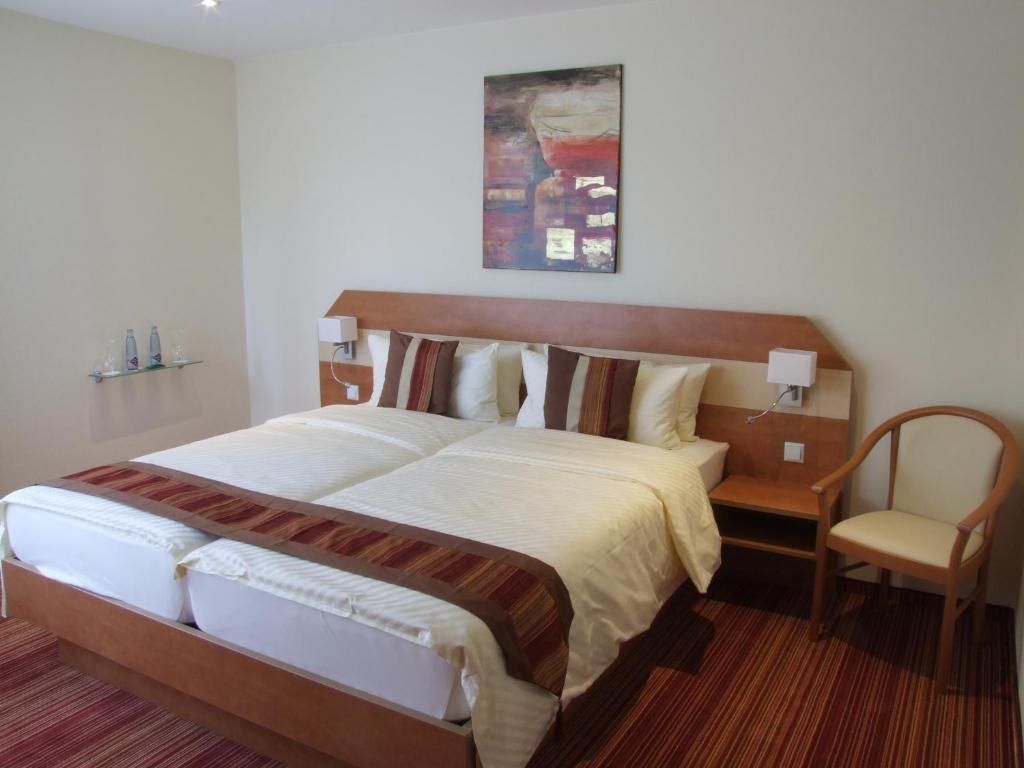 Postel nebo postele na pokoji v ubytování Boutique Hotel Wolfsburg