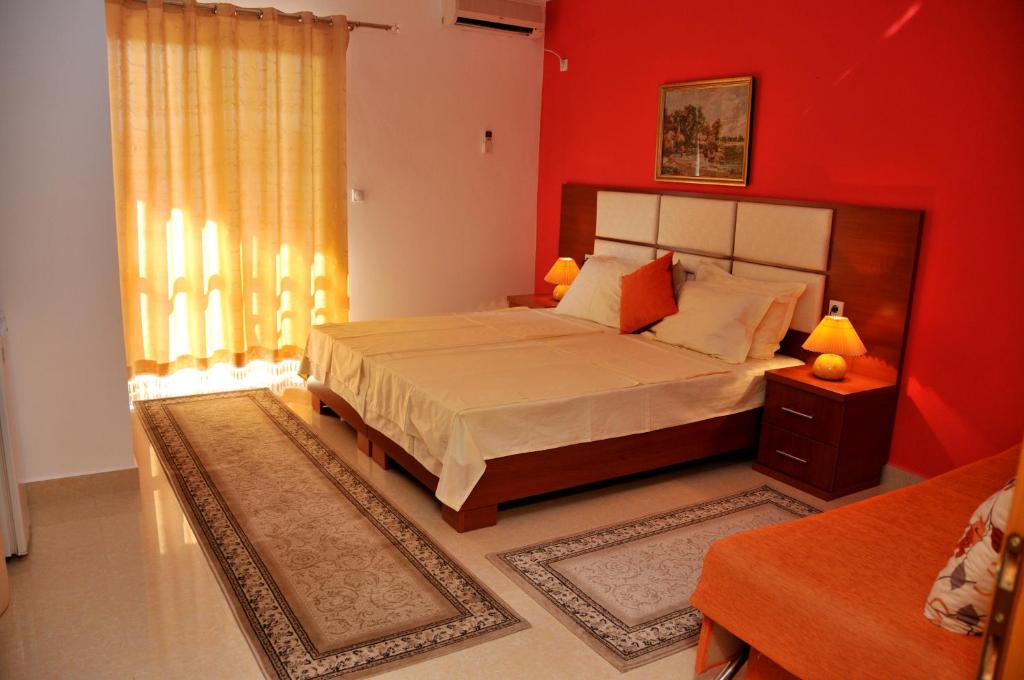 Postel nebo postele na pokoji v ubytování Aparthotel Villa Primafila
