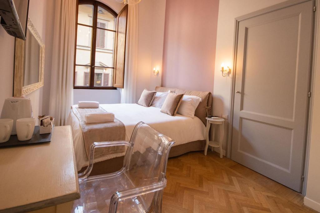 Posteľ alebo postele v izbe v ubytovaní B&B Dimora Sassetti 6