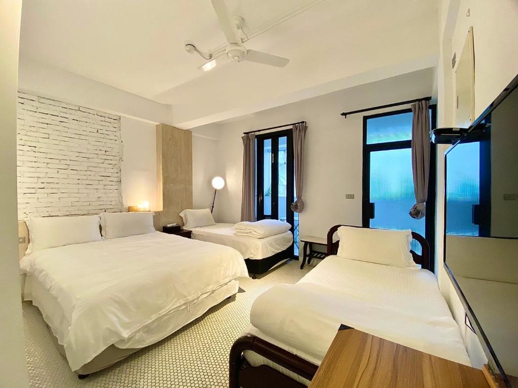 Posteľ alebo postele v izbe v ubytovaní 白狗公寓Amo B&B市區金三角 東大門夜市