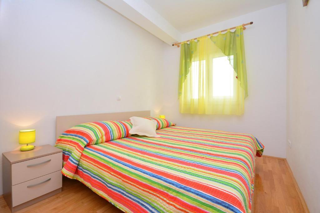 Posteľ alebo postele v izbe v ubytovaní Apartments Punta Milna