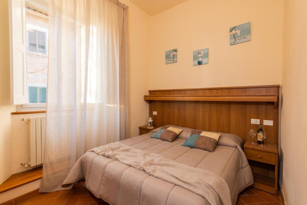Łóżko lub łóżka w pokoju w obiekcie B&B San Francesco