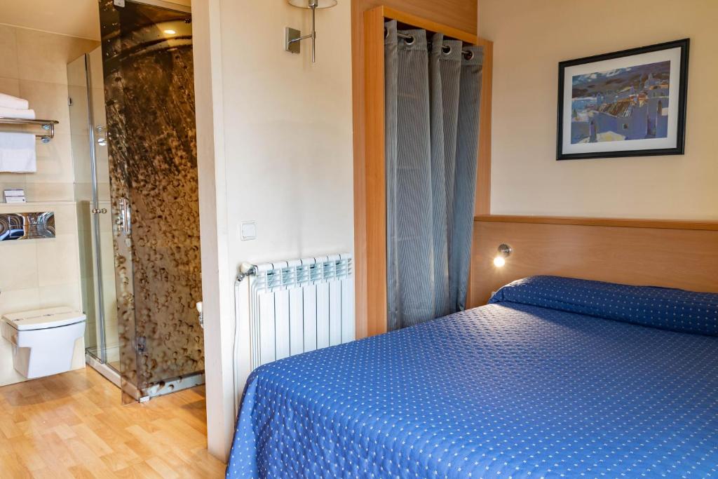 Postel nebo postele na pokoji v ubytování Hotel J. Balmes Vic