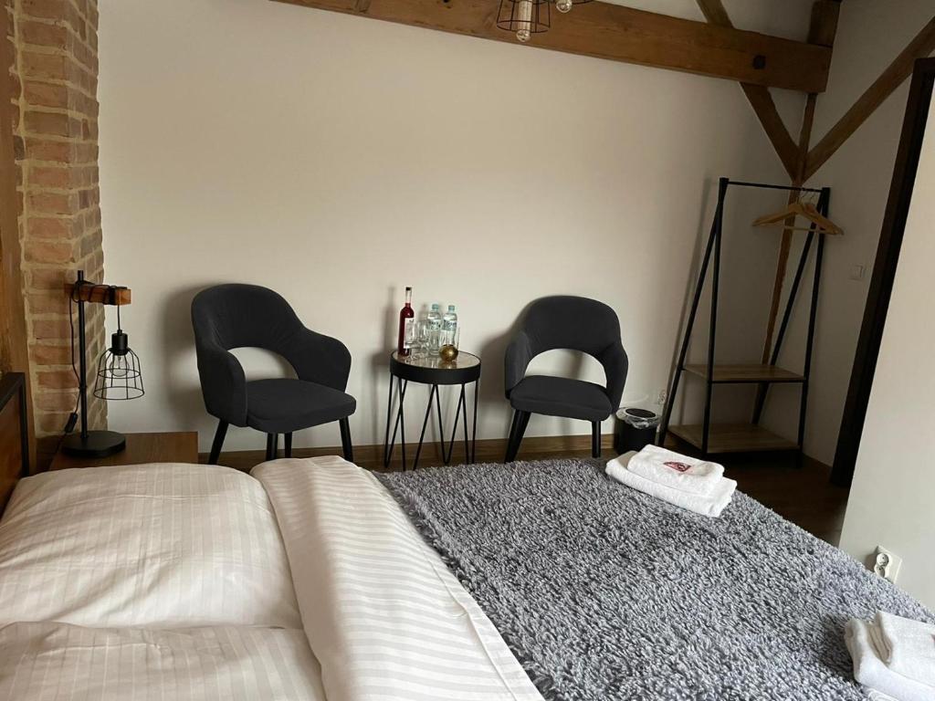 Łóżko lub łóżka w pokoju w obiekcie Miodosytnia