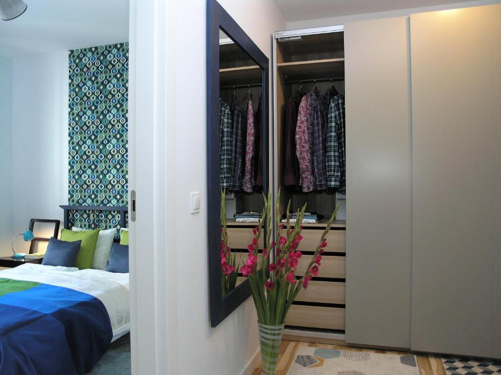 Posteľ alebo postele v izbe v ubytovaní Apartament Metro Kowieńska