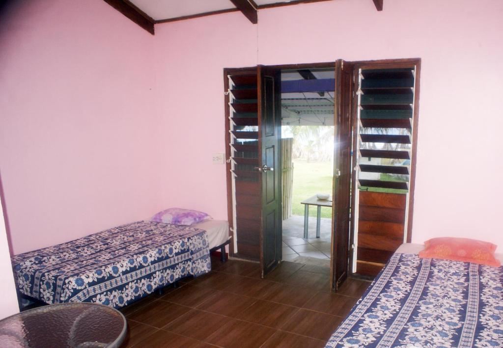 Postel nebo postele na pokoji v ubytování Bluepango Guest House