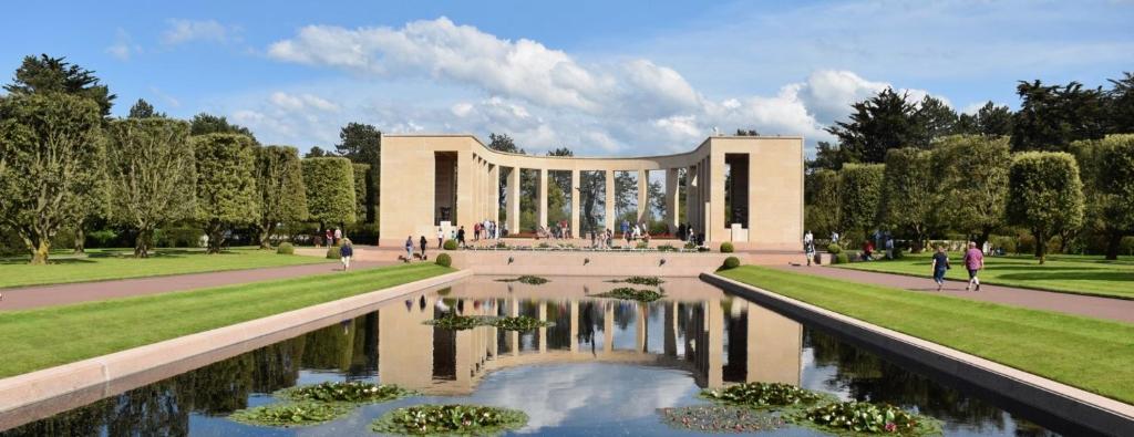 a rendering of a building with a pond in front of it at Villa kahlo Omaha Beach in Colleville-sur-Mer