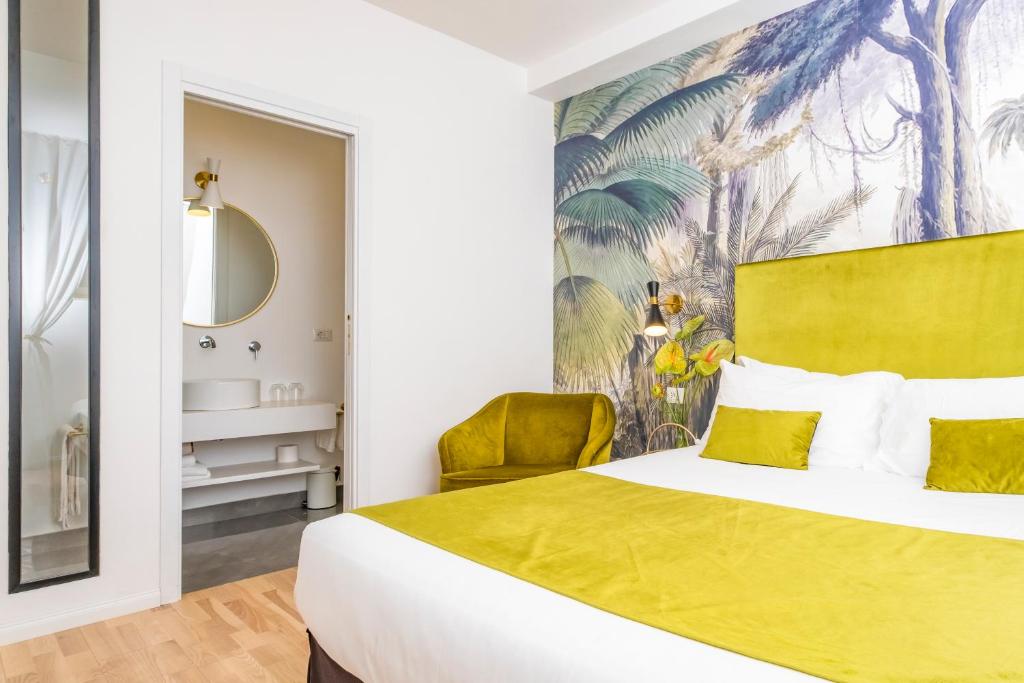 a bedroom with a yellow bed and a yellow chair at The Vista Rooms & Terrace in Rome