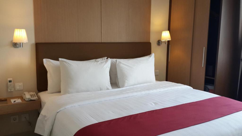 Letto o letti in una camera di Atria Residences Gading Serpong