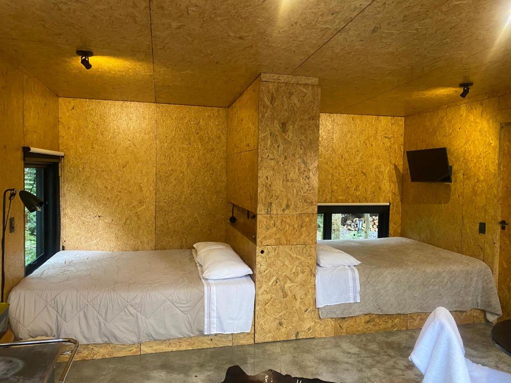 Postel nebo postele na pokoji v ubytování Chalé dos Alpes