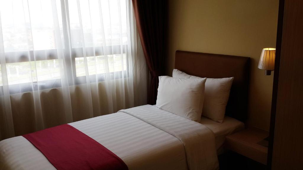 Letto o letti in una camera di Atria Residences Gading Serpong
