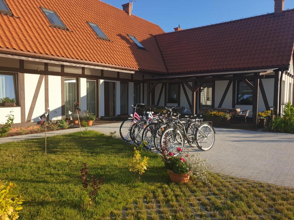 a group of bikes parked in front of a building at Serce Puszczy Wiartel in Wiartel