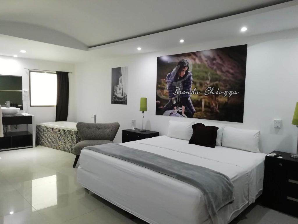 Tempat tidur dalam kamar di Essenzia de Cancun