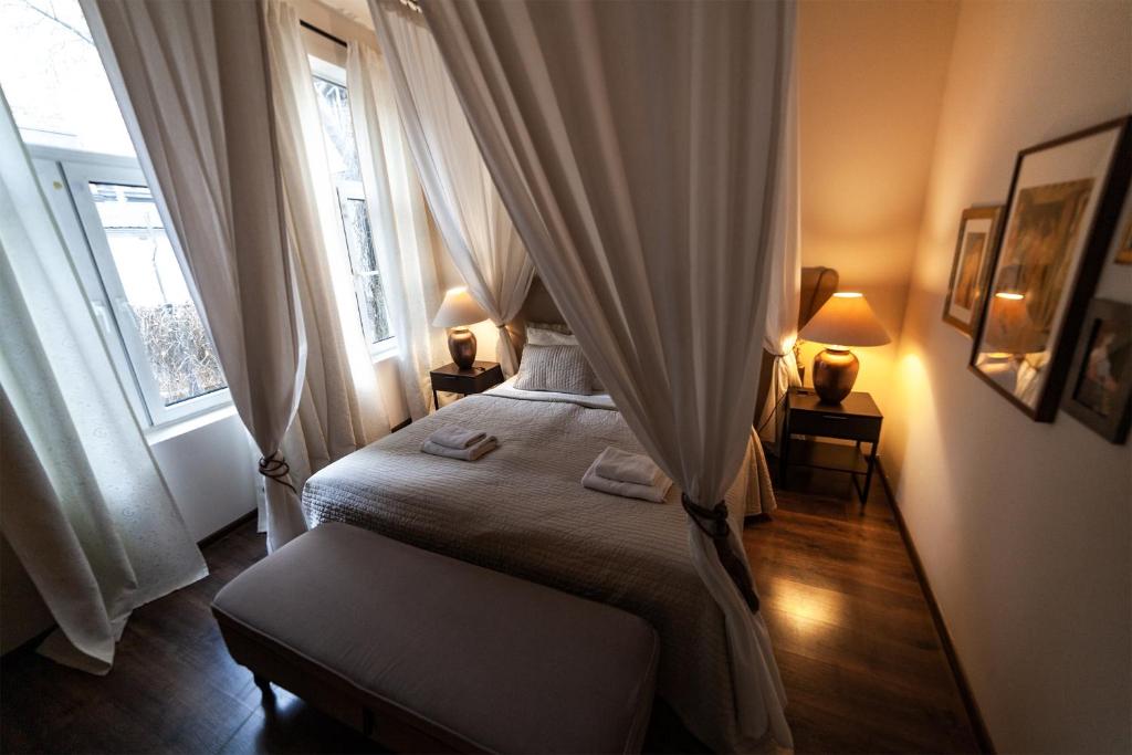Posteľ alebo postele v izbe v ubytovaní Lounge Apartments
