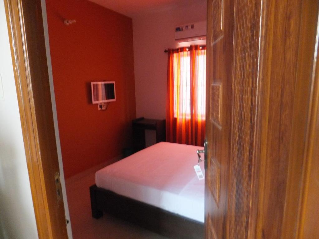 Postel nebo postele na pokoji v ubytování KV Residency