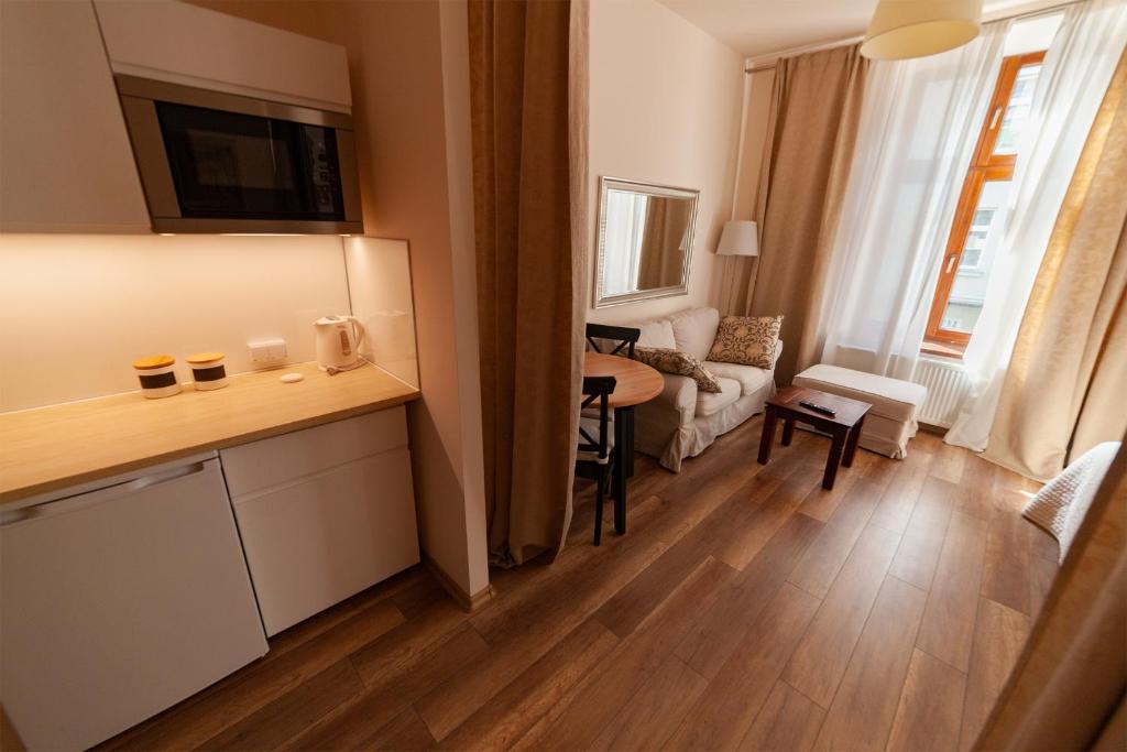 Televízia a/alebo spoločenská miestnosť v ubytovaní Lounge Apartments