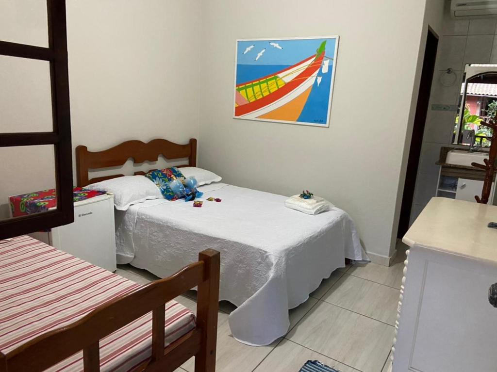 Postel nebo postele na pokoji v ubytování Pousada Água do Mar