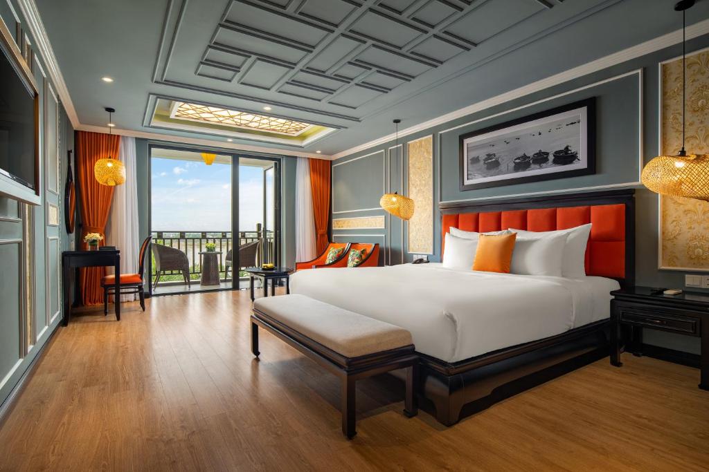 Postel nebo postele na pokoji v ubytování Bel Marina Hoi An Resort