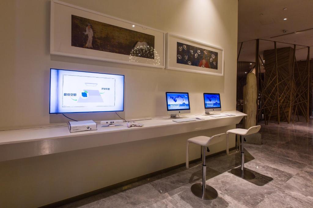 TV a/nebo společenská místnost v ubytování Skytel Hotel Chengdu-City Center