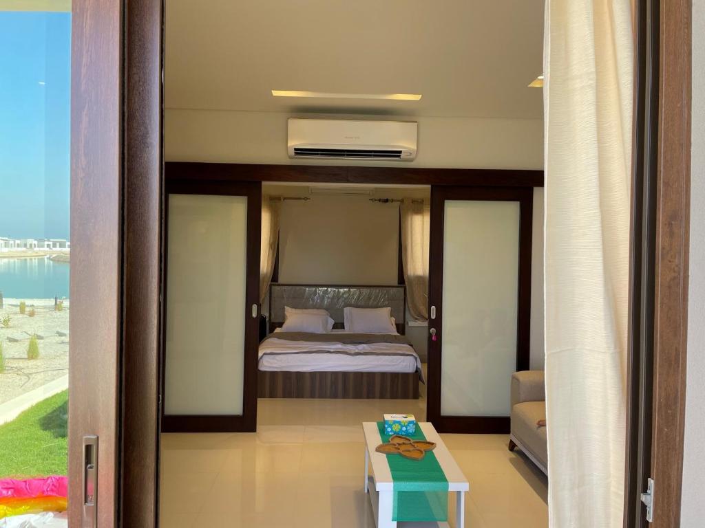 Postel nebo postele na pokoji v ubytování Mokango Apartment Hawana Salalah