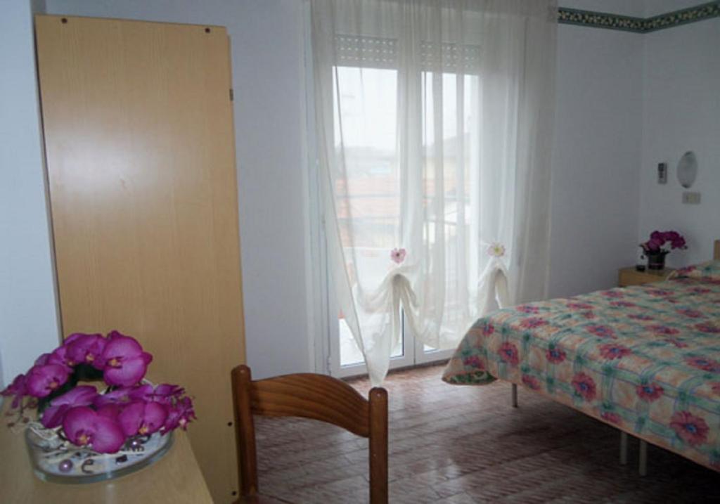 Postel nebo postele na pokoji v ubytování Atene Albergo Riccione