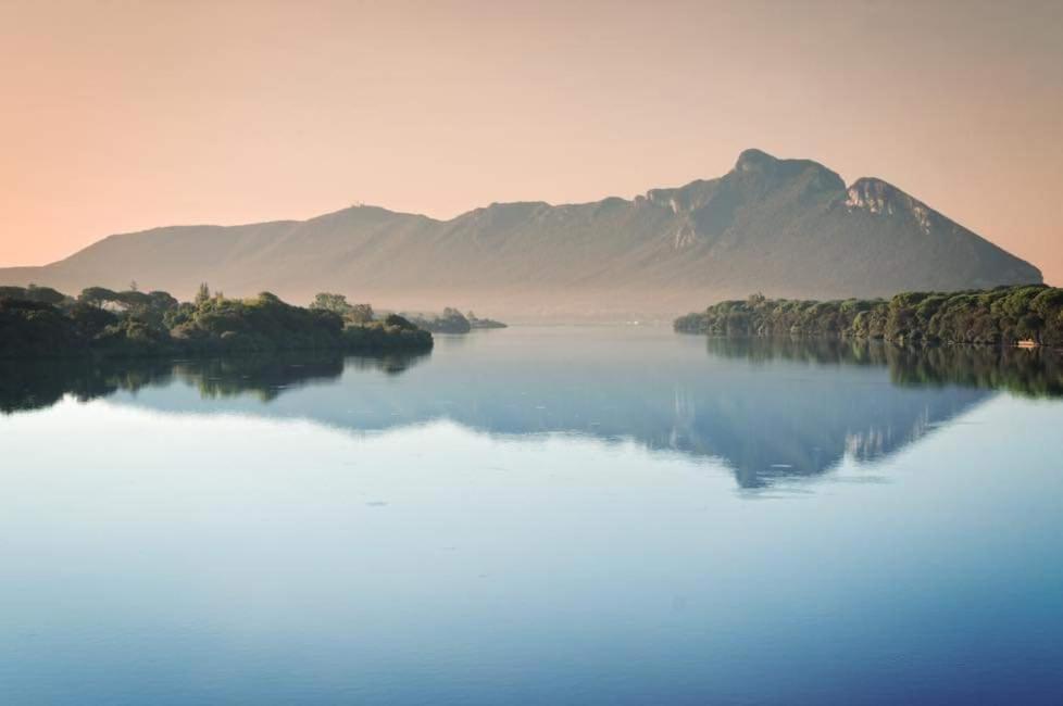 a large body of water with a mountain in the background at Casale Del Borgo in Hermada