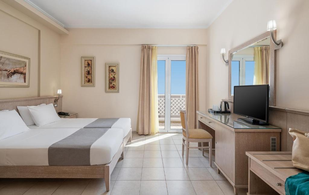 Postel nebo postele na pokoji v ubytování Magda Hotel Club