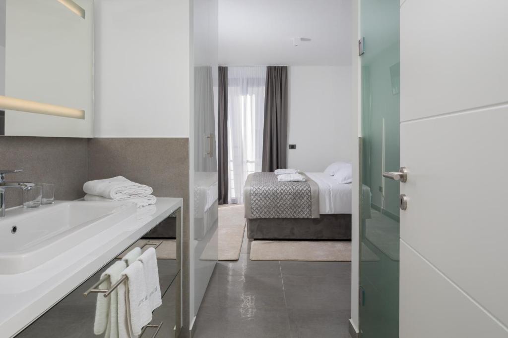 Posteľ alebo postele v izbe v ubytovaní Villas Baotić