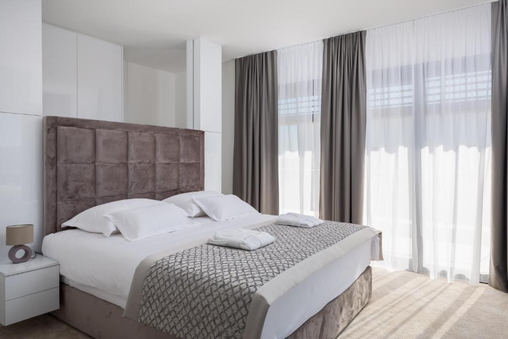 Posteľ alebo postele v izbe v ubytovaní Villas Baotić