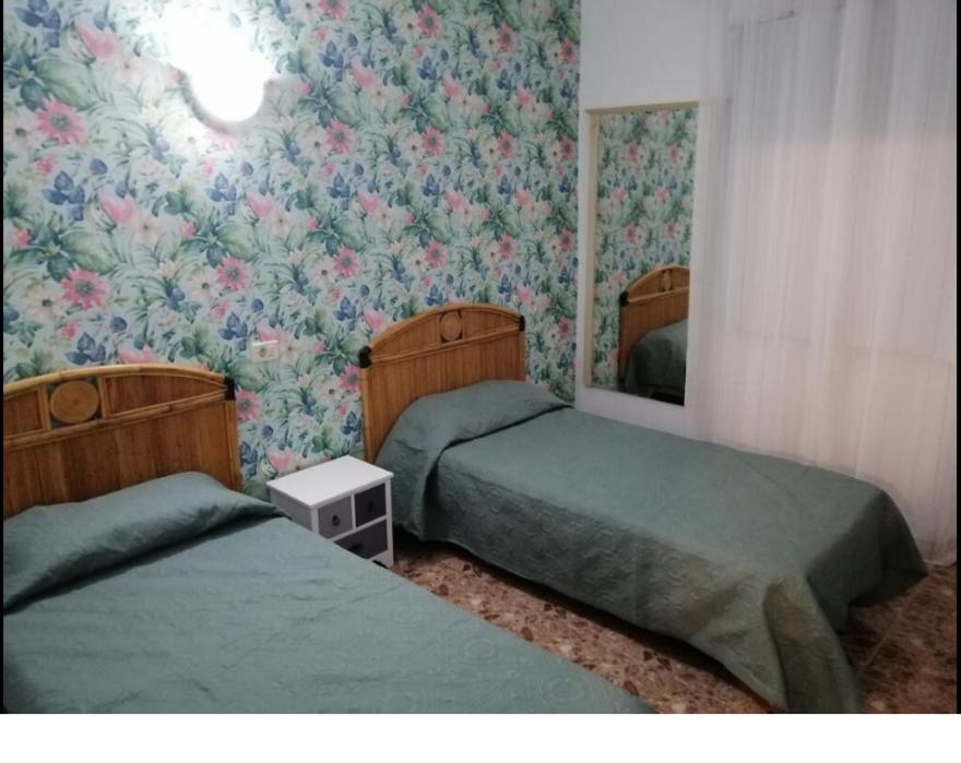 Postel nebo postele na pokoji v ubytování Alcaravaneras Hostel