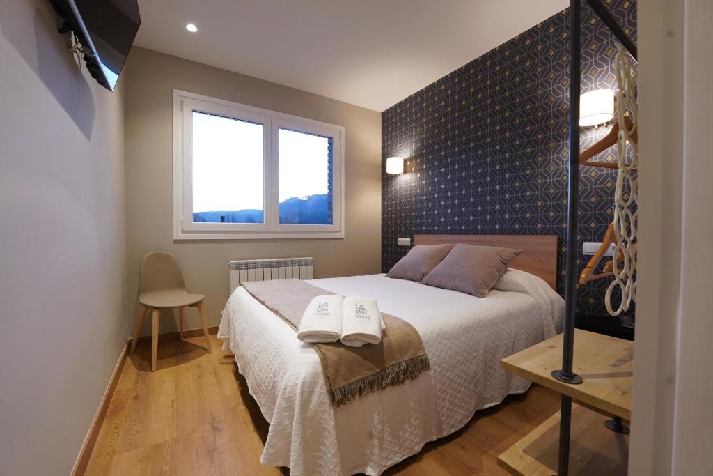 Postel nebo postele na pokoji v ubytování Larrion Hostal - Ostatua