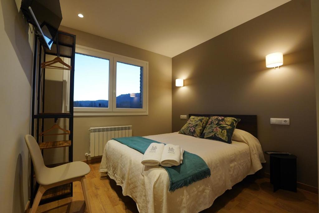 Postel nebo postele na pokoji v ubytování Larrion Hostal - Ostatua