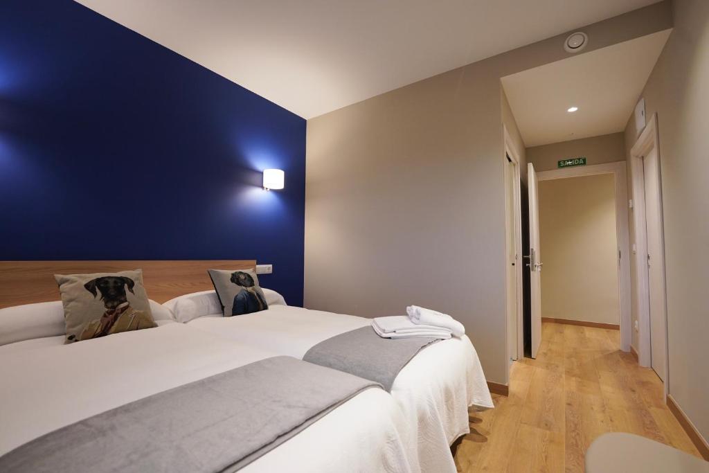 Postel nebo postele na pokoji v ubytování Larrion Hostal - Ostatua