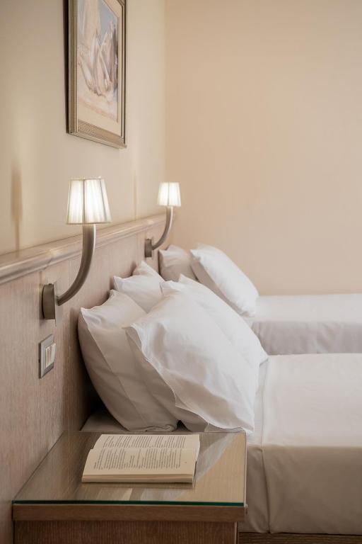 Postel nebo postele na pokoji v ubytování Magda Hotel Club