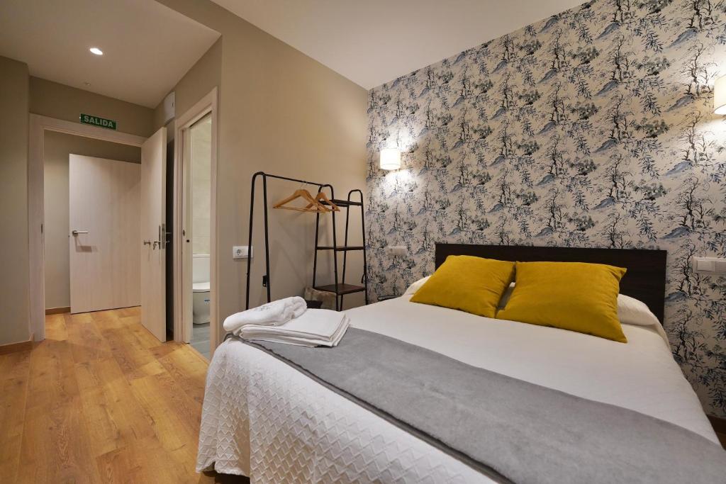 Postel nebo postele na pokoji v ubytování Larrion Hostal - Ostatua